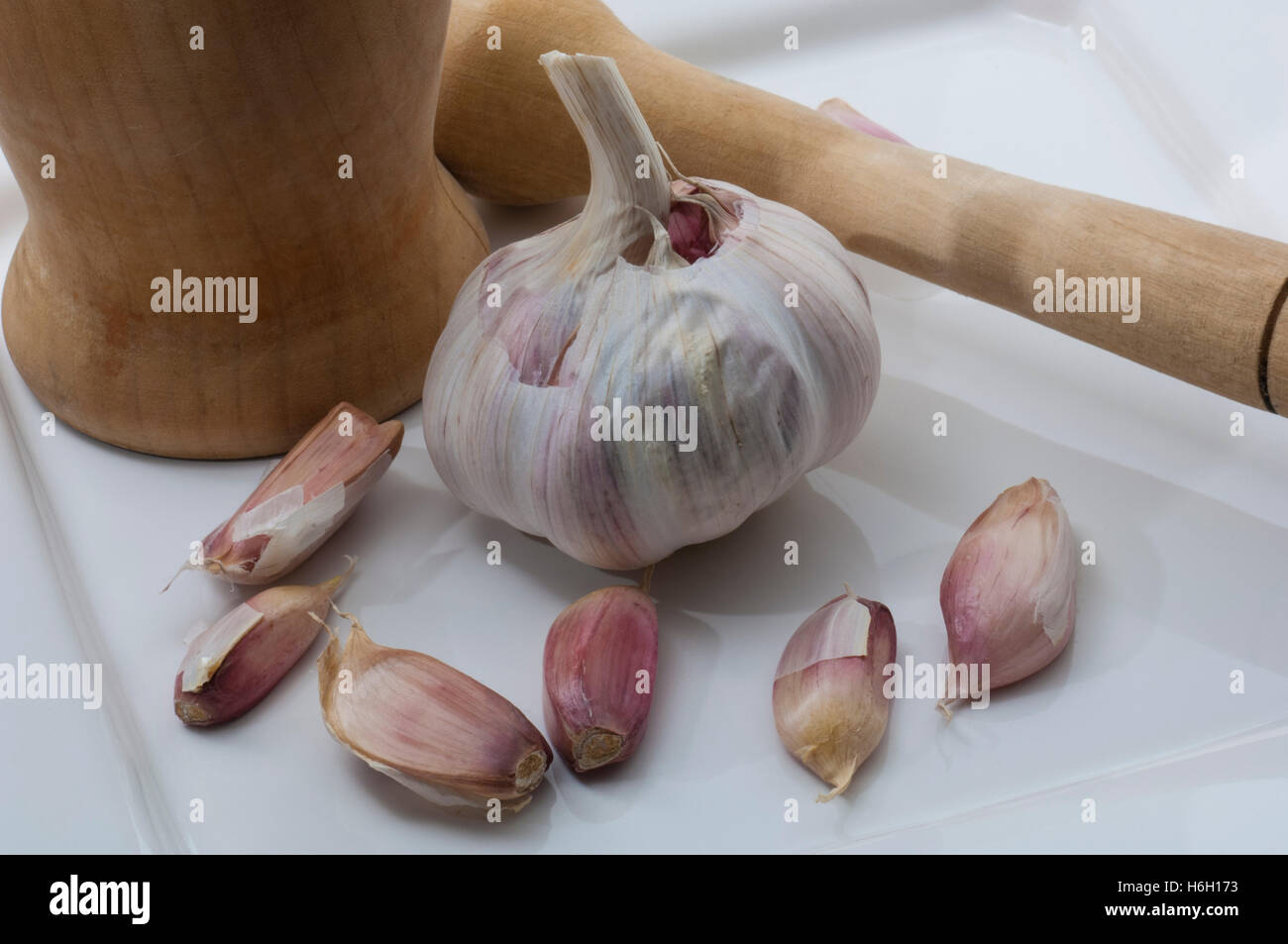 Garlic with mortar and pestle Stock Photo