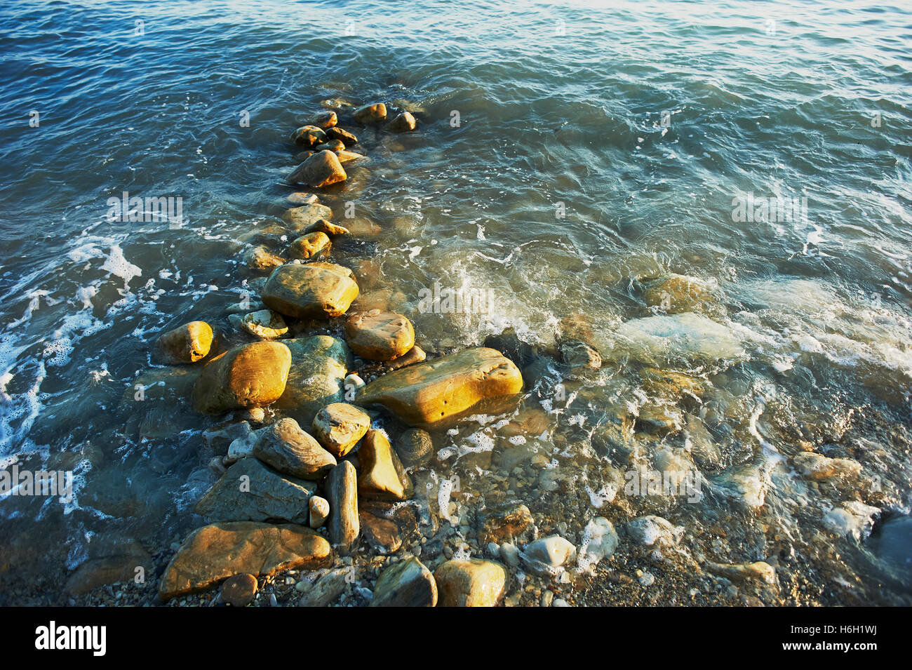 Wet sea rocks, washed by the waves. Close Stock Photo - Alamy