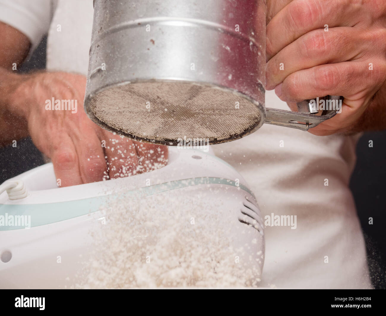 Sifting flour. Making Yogurt Cake Stock Photo Alamy
