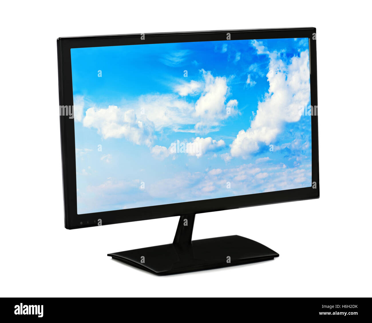 Black lcd monitor with blue sky isolated on white background. Closeup. Stock Photo