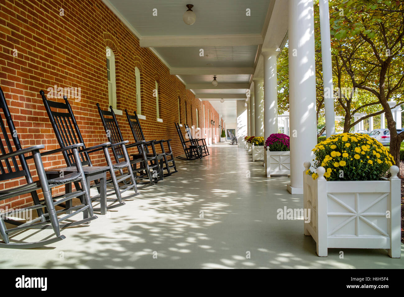 Sun dappled porches with classic rocking chairs; Omni Bedford Springs Resort & Spa; Bedford; Pennsylvania; USA Stock Photo