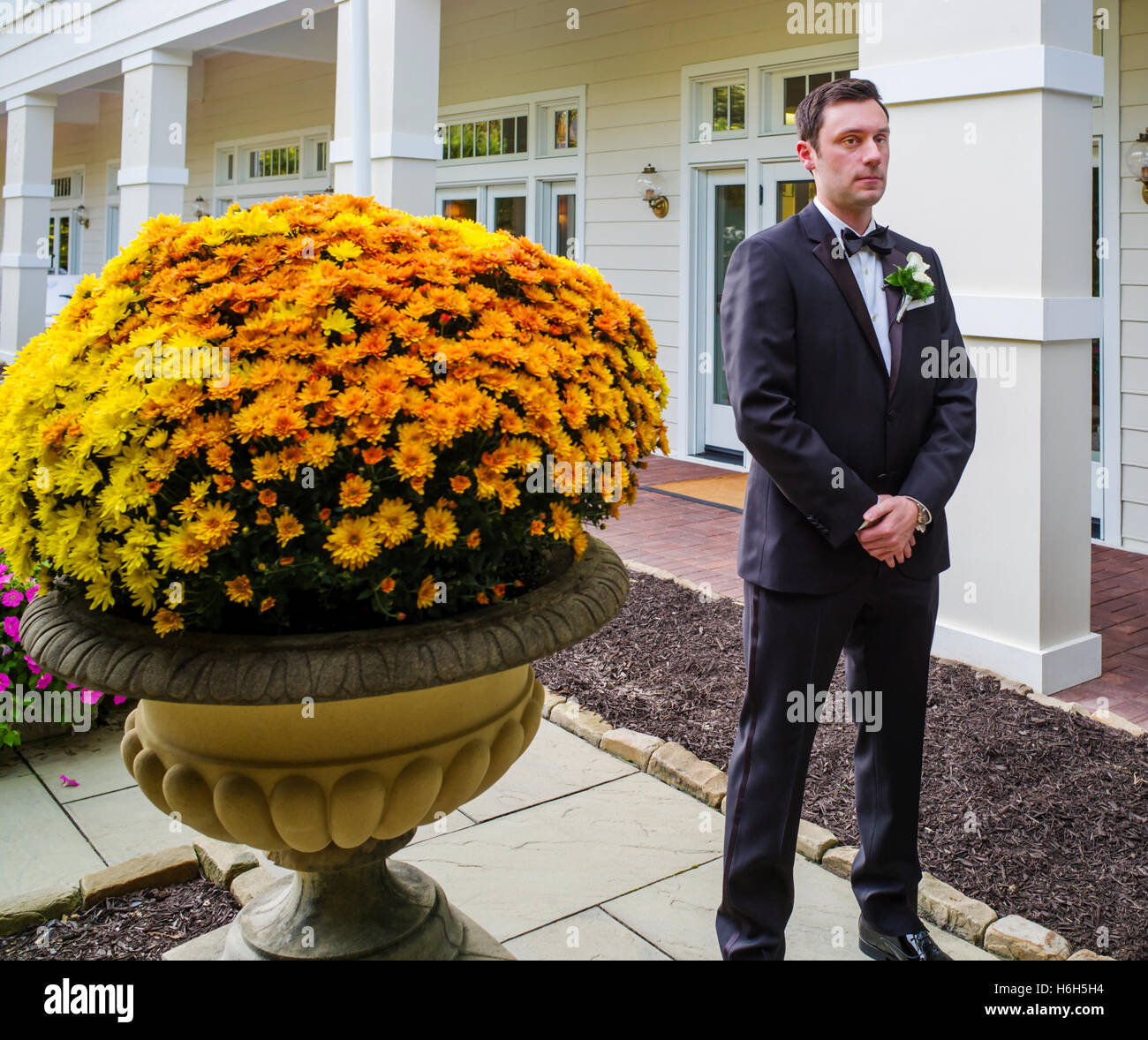 Groom waiting nervously for bride for wedding photographs; Omni Bedford Springs Resort & Spa; Bedford; Pennsylvania; USA Stock Photo