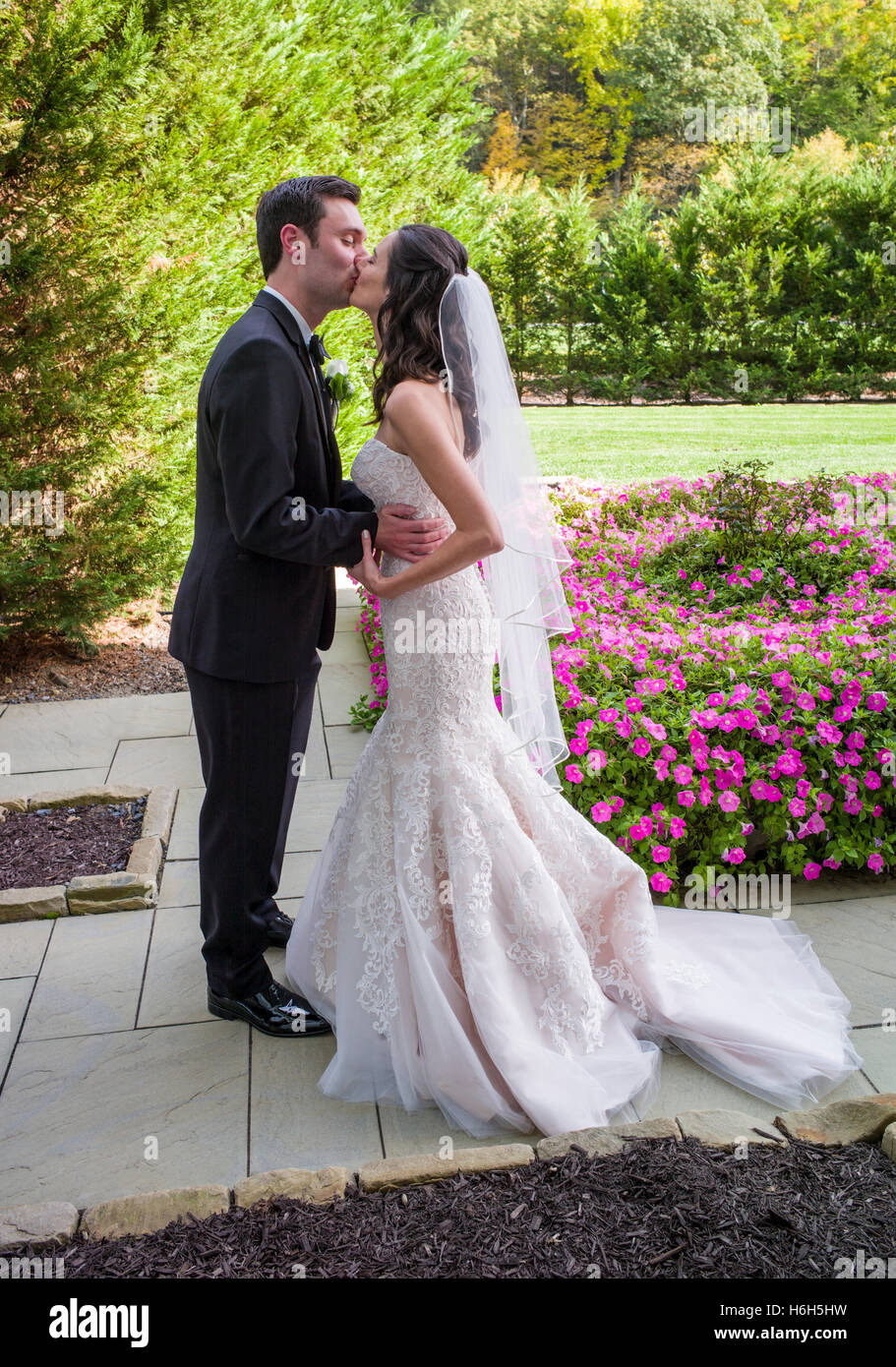 Groom & bride kiss for wedding photographs; Omni Bedford Springs Resort & Spa; Bedford; Pennsylvania; USA Stock Photo