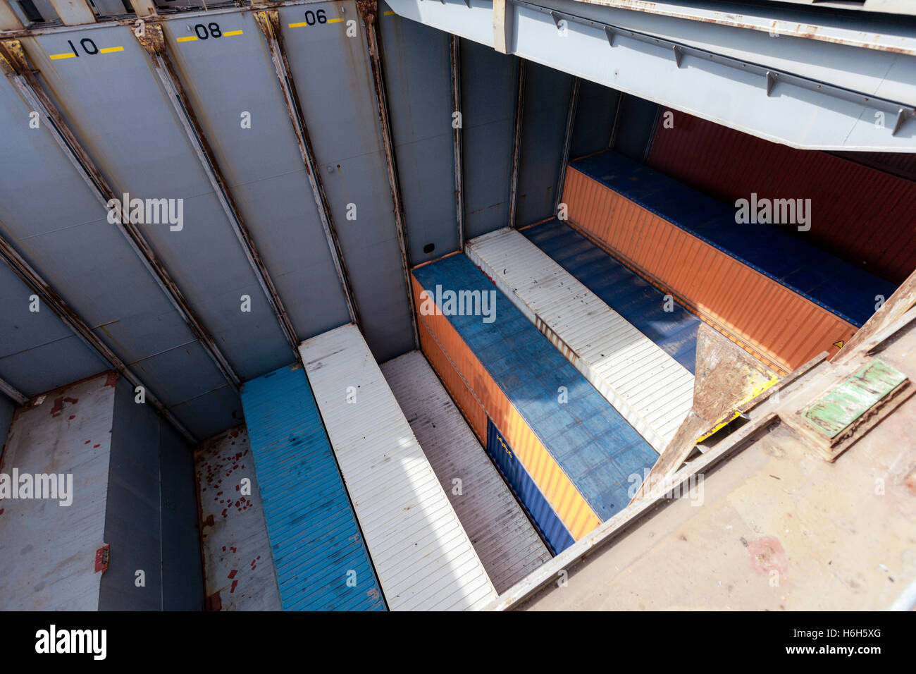 View of a freighter ship's storage compartment, half full with