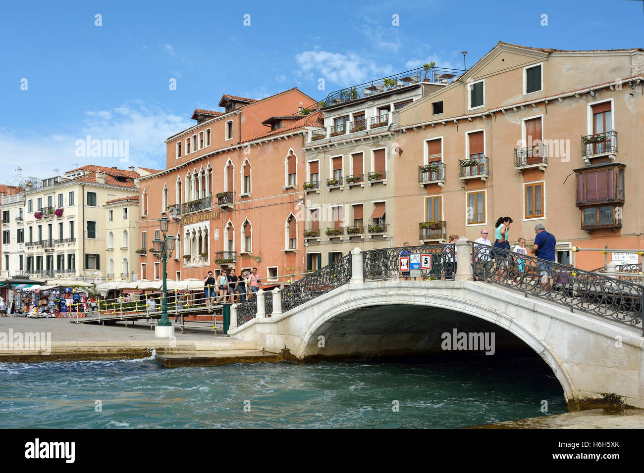 Waterfront Riva degli Schiavoni with Tourists in San Marco of Venice in Italy. Stock Photo