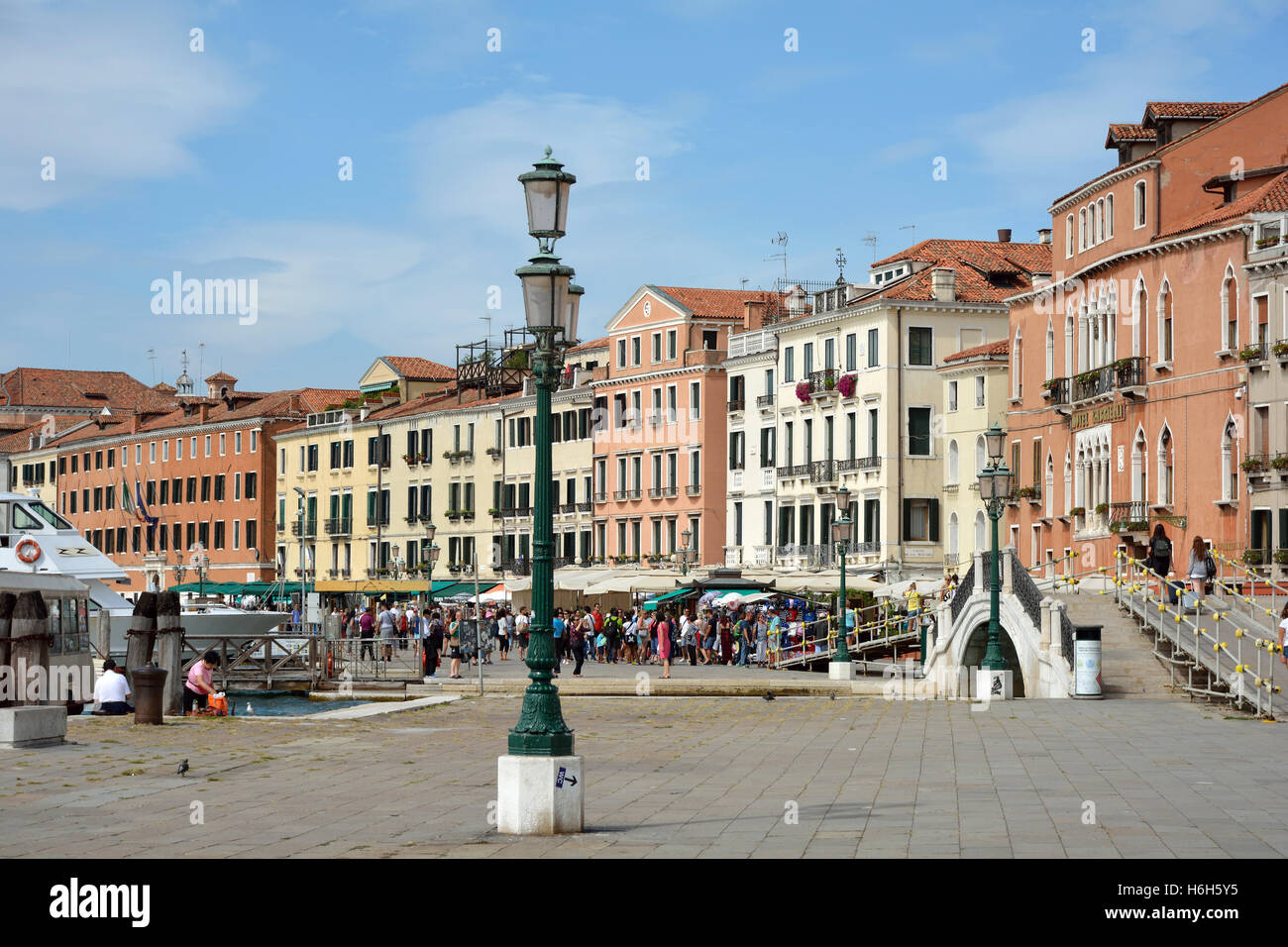 Waterfront Riva degli Schiavoni with Tourists in San Marco of Venice in Italy. Stock Photo