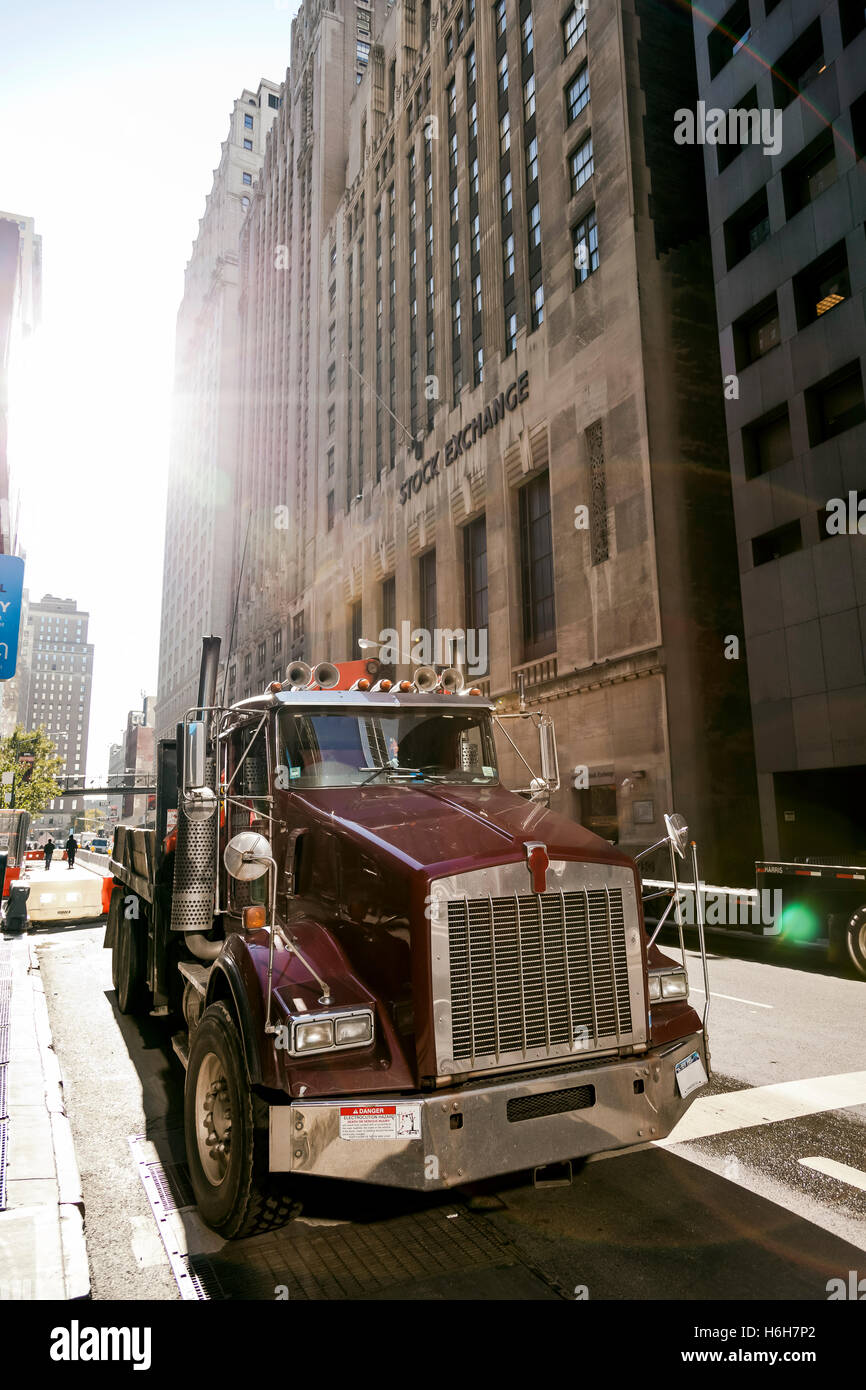 A semi-trailer truck parked by the American Stock Exchange building in Manhattan. Stock Photo
