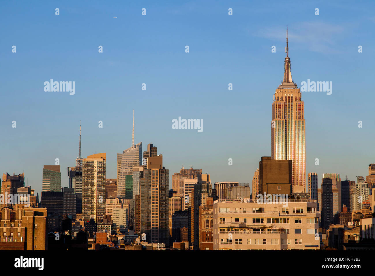The tight cluster of skyscrapers habitating midtown Manhattan with the famous Empire State Building most prominent, as seen view Stock Photo