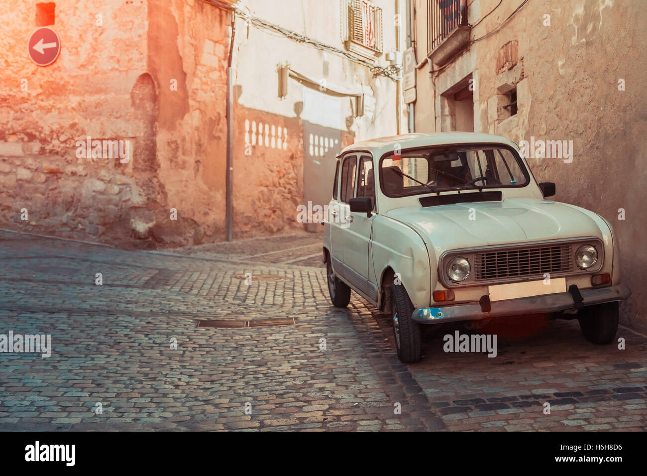 Retro car on ancient street of Girona, paving stone, sunny day, vintage  colour Stock Photo - Alamy