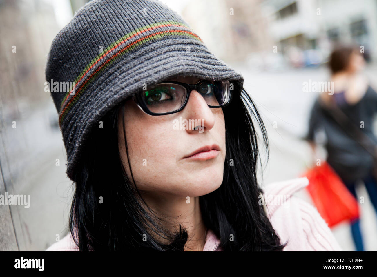 Urban portrait of a woman in her early thirties. Stock Photo