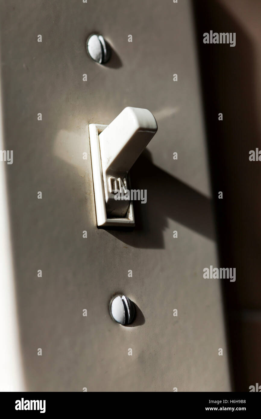 Light switch turned on Stock Photo Alamy