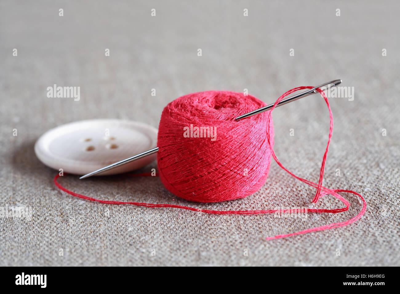 Red thread isolate on white background. Selective focus Stock Photo - Alamy