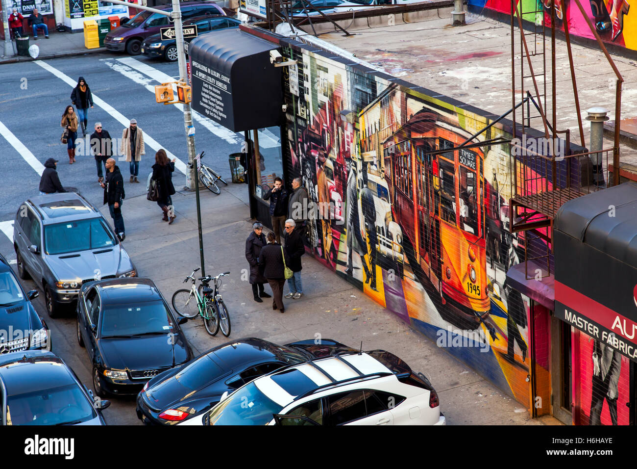 NEW-YORK - NOV 17: Wall painting of a tram in Times Square on a busy Manhattan street in New-York, USA on November 17, 2012. Stock Photo