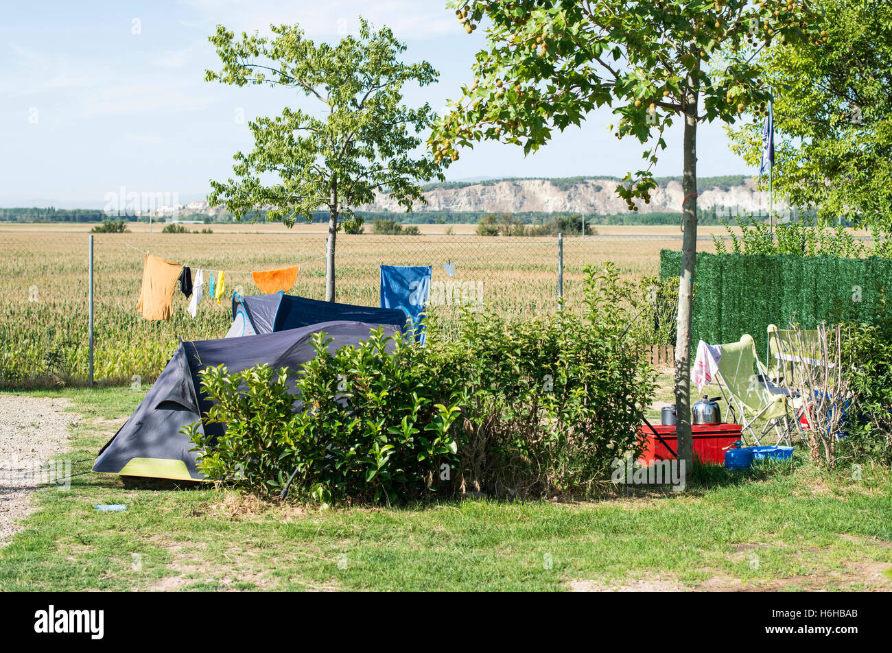 Tents on campsite. Green meadow Stock Photo - Alamy