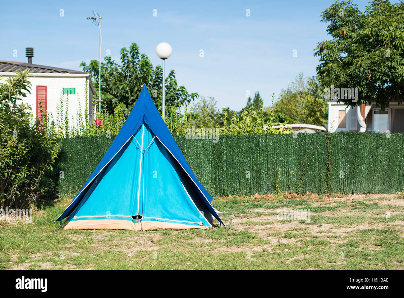 Tents on campsite. Green meadow Stock Photo - Alamy