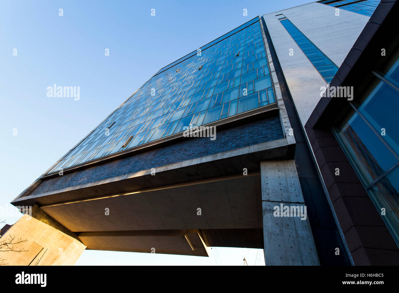 NEW-YORK - NOV 17: Low angle view of a modern building rising above the Highline Park in New-York, USA on November 17, 2012. Stock Photo