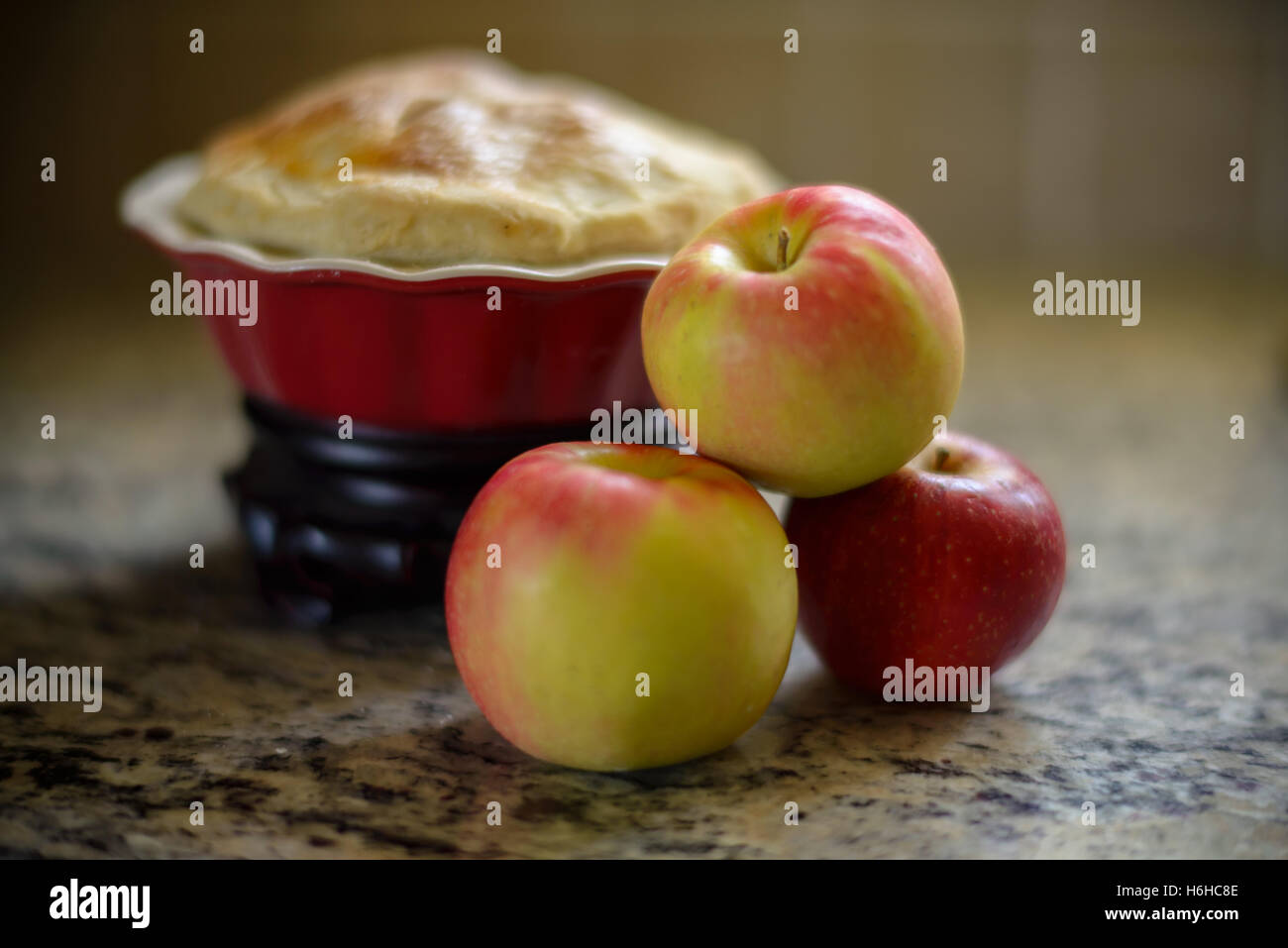 Apples with a apple pie on a kitchen counter Stock Photo Alamy