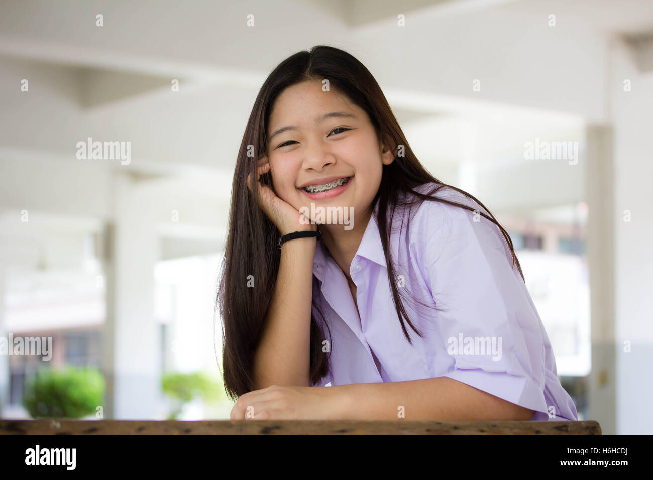 Portrait of thai high school student uniform teen beautiful girl happy and relax Stock Photo