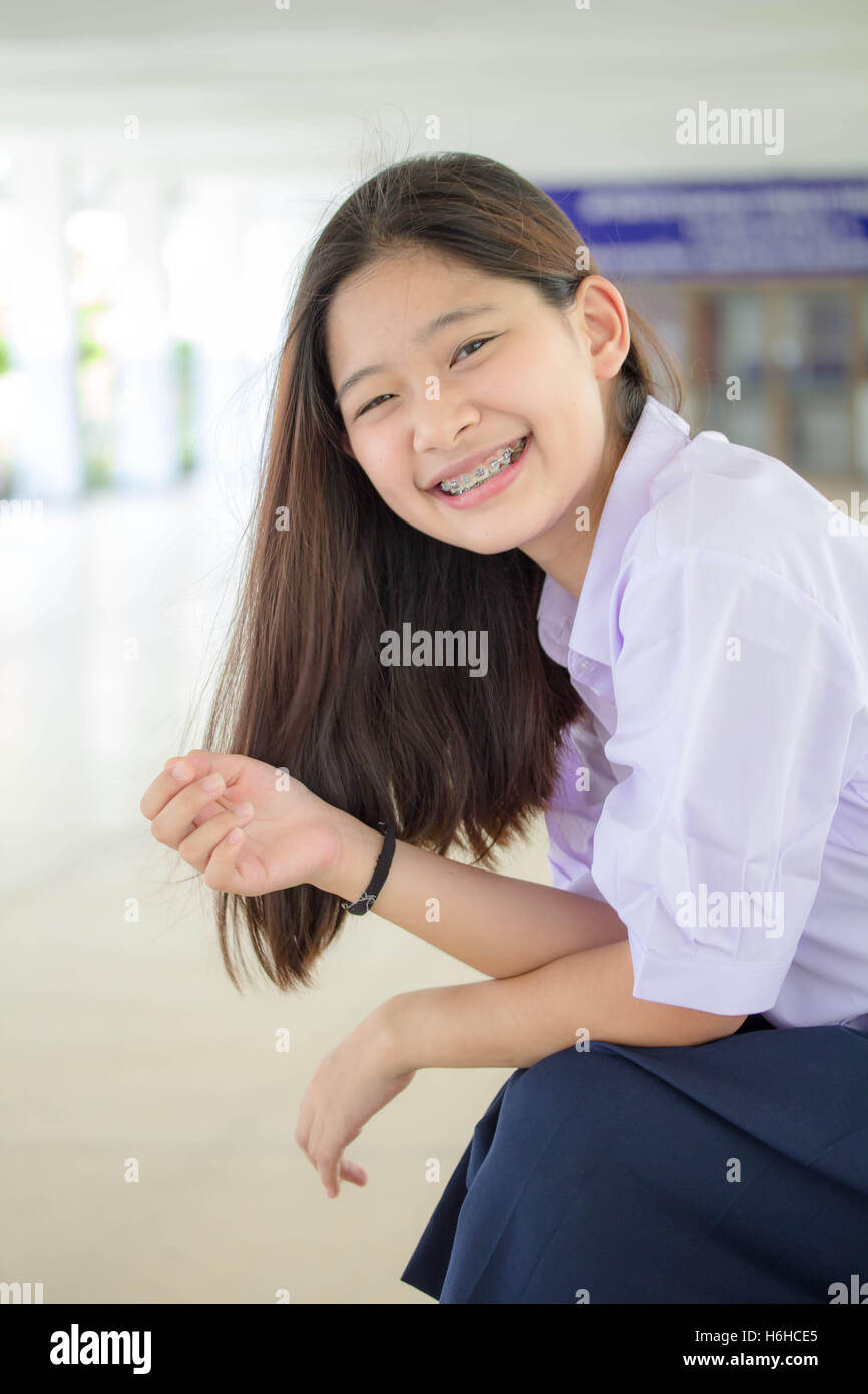 Portrait of thai high school student uniform teen beautiful girl happy and relax Stock Photo