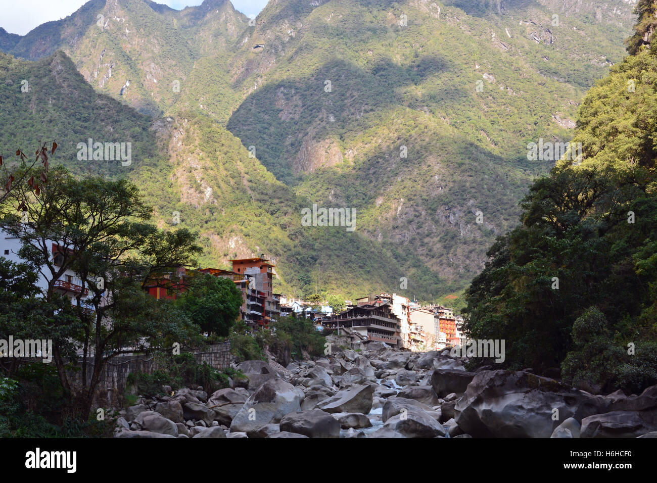 The boulder strewn Willkanuta River during the winter dry season leading out of Aguas Calientes at the base of Machu Picchu. Stock Photo