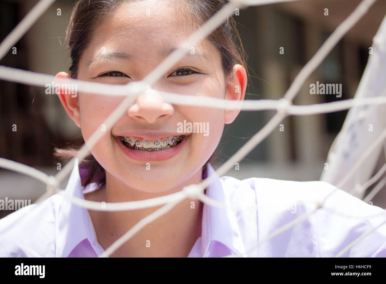 Portrait of thai high school student uniform teen beautiful girl happy and relax Stock Photo