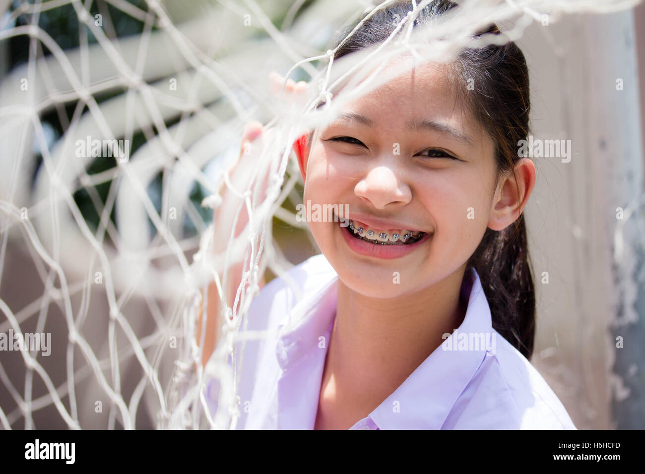Portrait of thai high school student uniform teen beautiful girl happy and relax Stock Photo