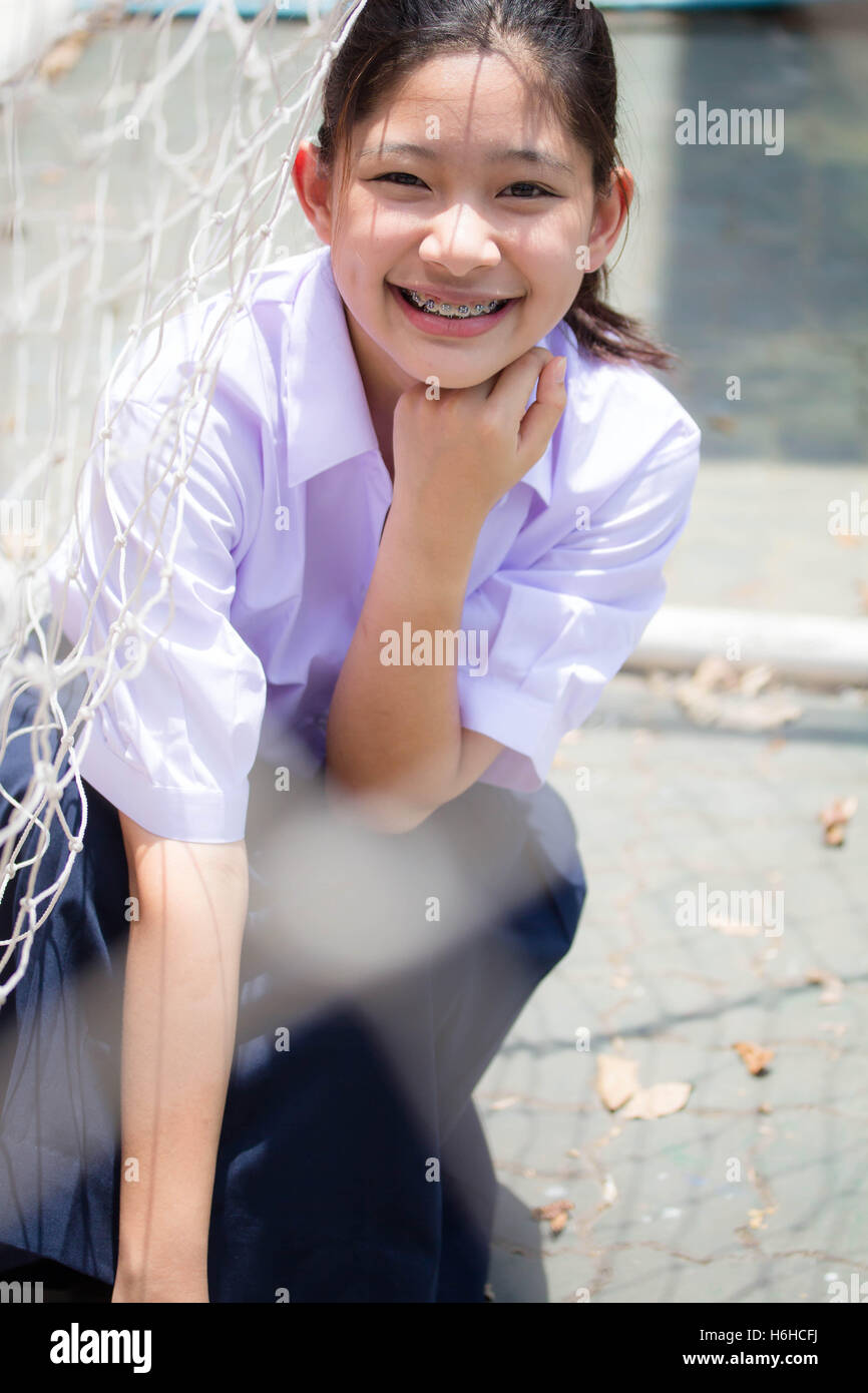 Portrait of thai high school student uniform teen beautiful girl happy and relax Stock Photo