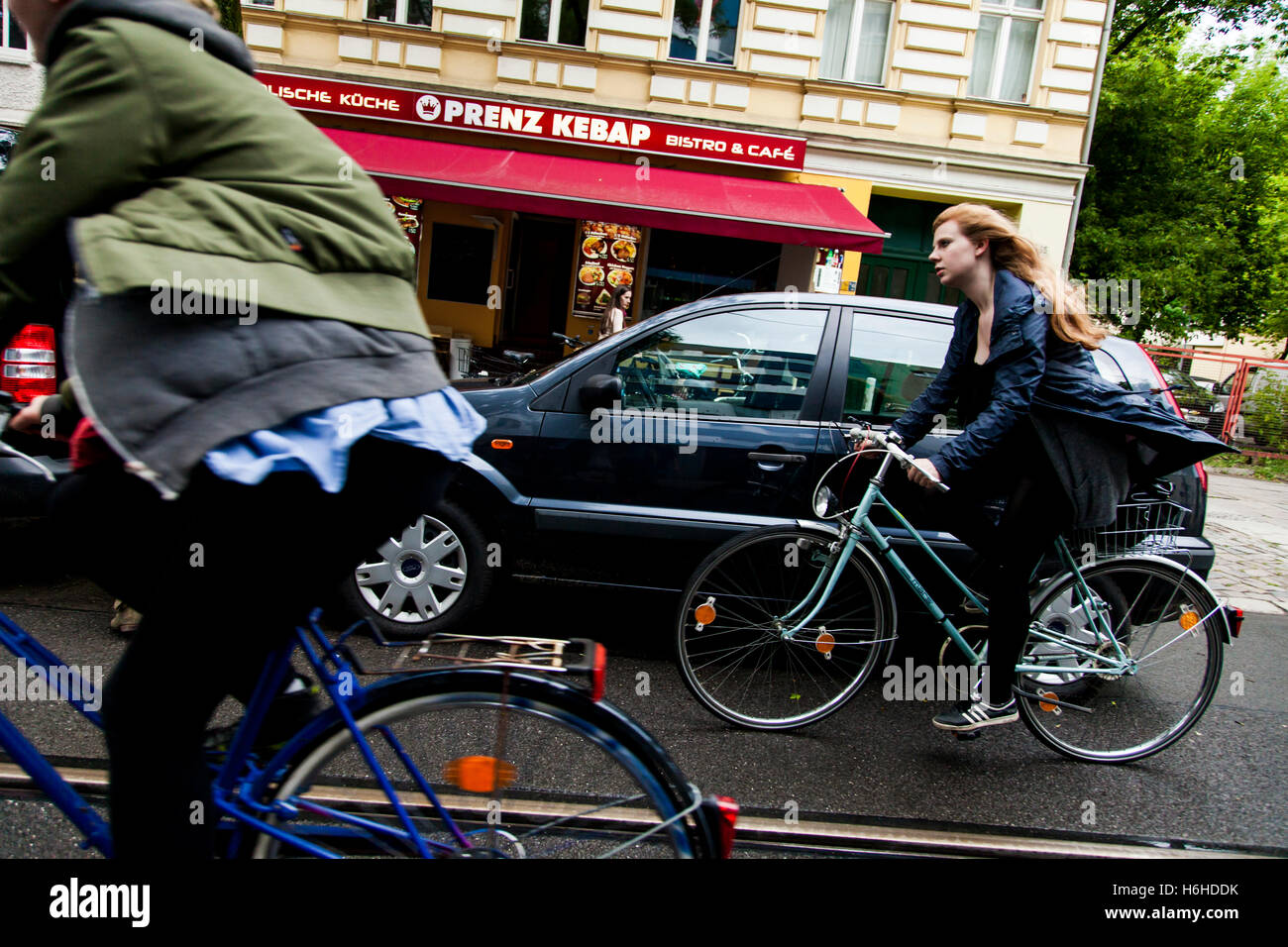 BERLIN - JUNE 16: Cyclers in the street on an inclement day on June 16, 2012 in Berlin, Germany. Stock Photo