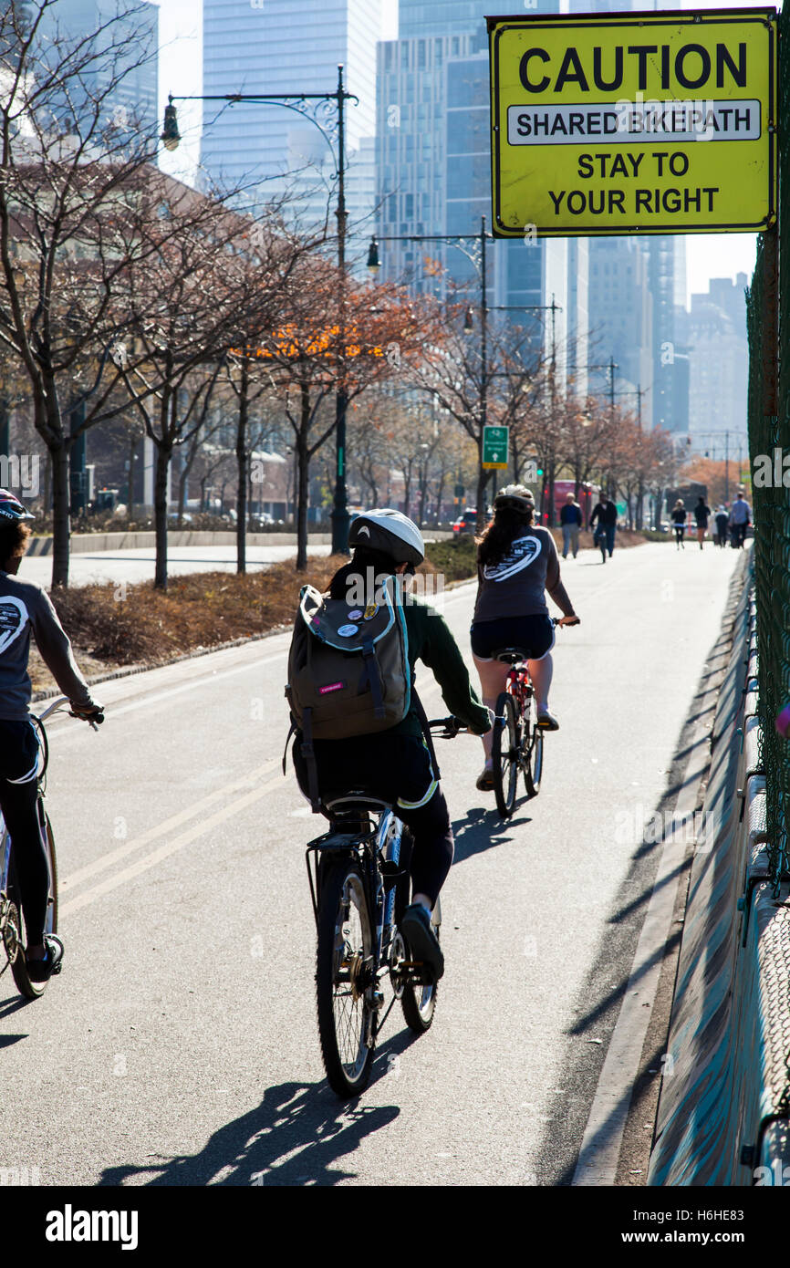 New-York, USA - NOV 21: Cyclers on a Manhattan bikepath on November 21, 2012 in New-York, USA. Stock Photo