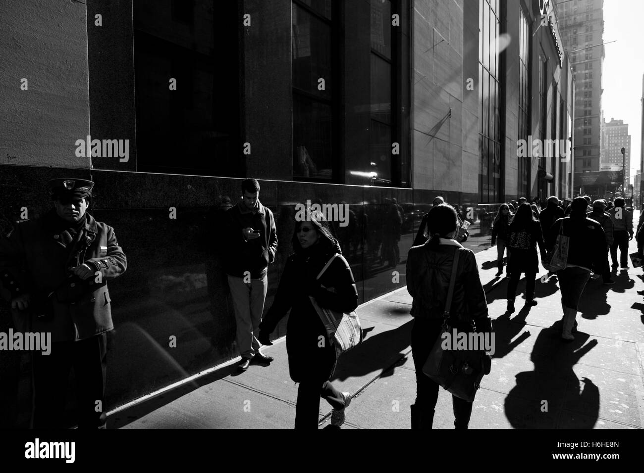 NEW-YORK - NOV 9: Pedestrians walking on the pavement in New-York, USA on November 9, 2012. Stock Photo