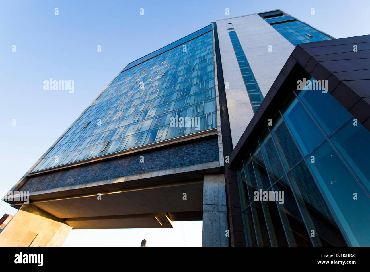 NEW-YORK - NOV 17: Low angle view of a modern building rising above the Highline Park in New-York, USA on November 17, 2012. Stock Photo