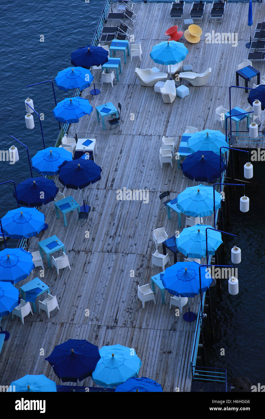 Looking down on a colourful harbour café in Sorrento Italy Stock Photo