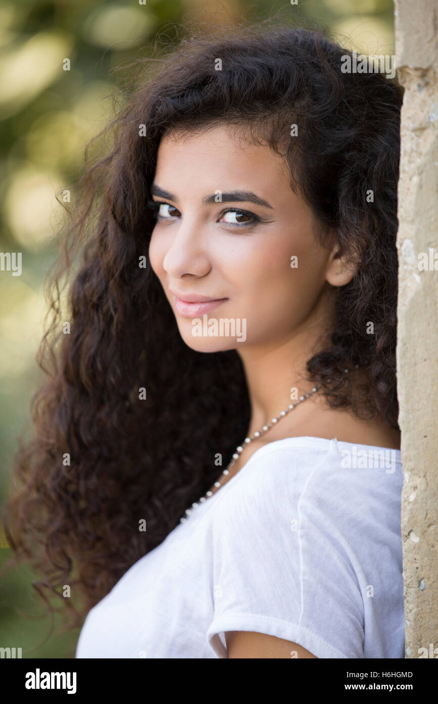 beautiful young woman smiling outdoors Stock Photo - Alamy