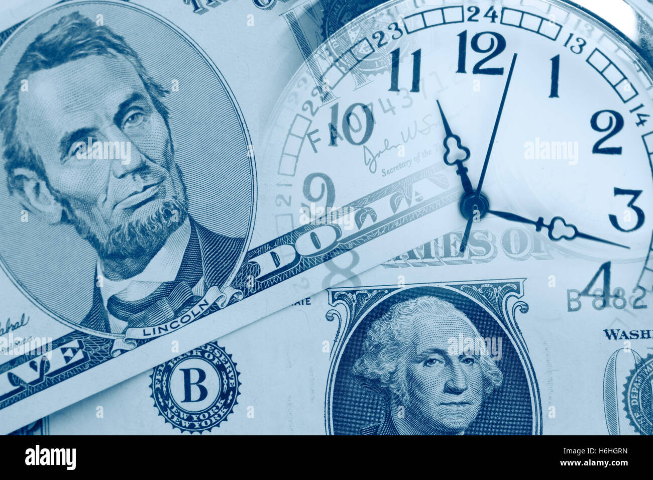 Clock faces and American currency Stock Photo - Alamy