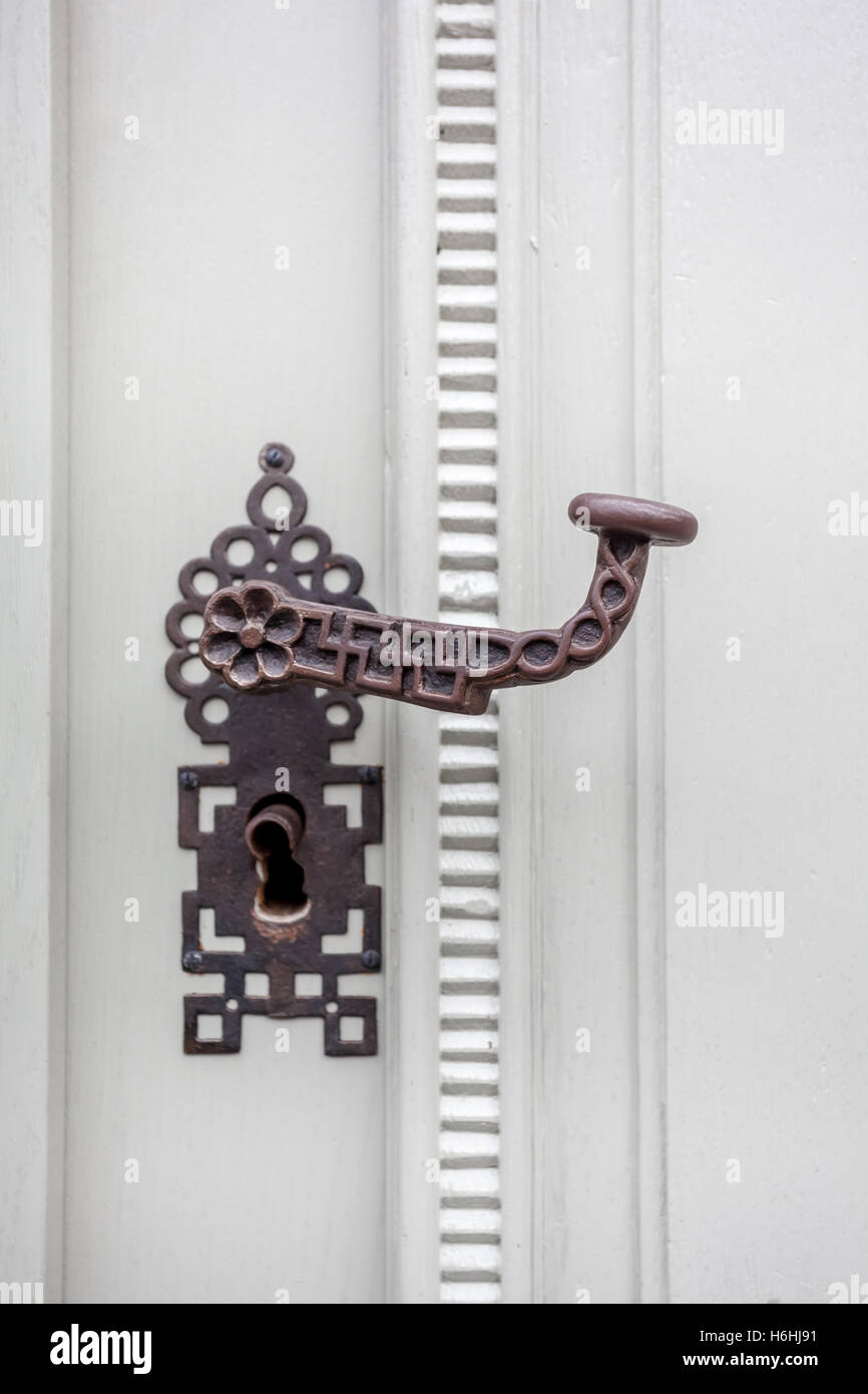 on an old door is a door handle with key lock Stock Photo Alamy