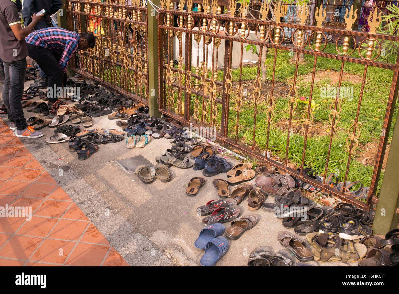 Worshipers leave their shoes outside a temple during the Festival of Diwali, or Deepavali, in Little India, Singapore Stock Photo
