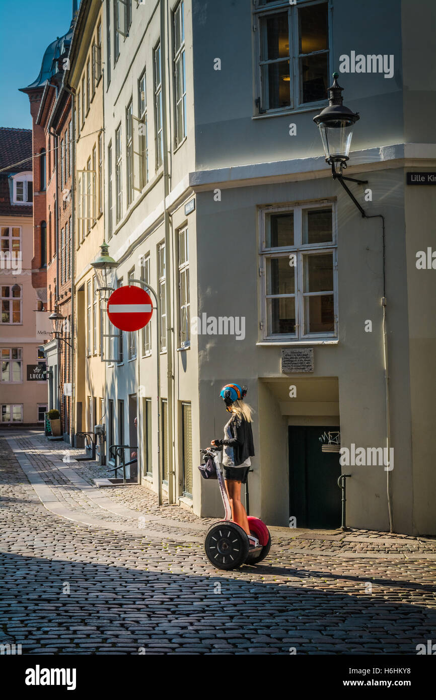A woman riding a Segway personal transporter, Copenhagen, Denmark Stock Photo