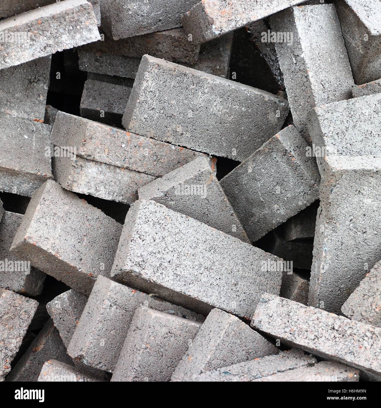 Heap of grey bricks. Stock Photo