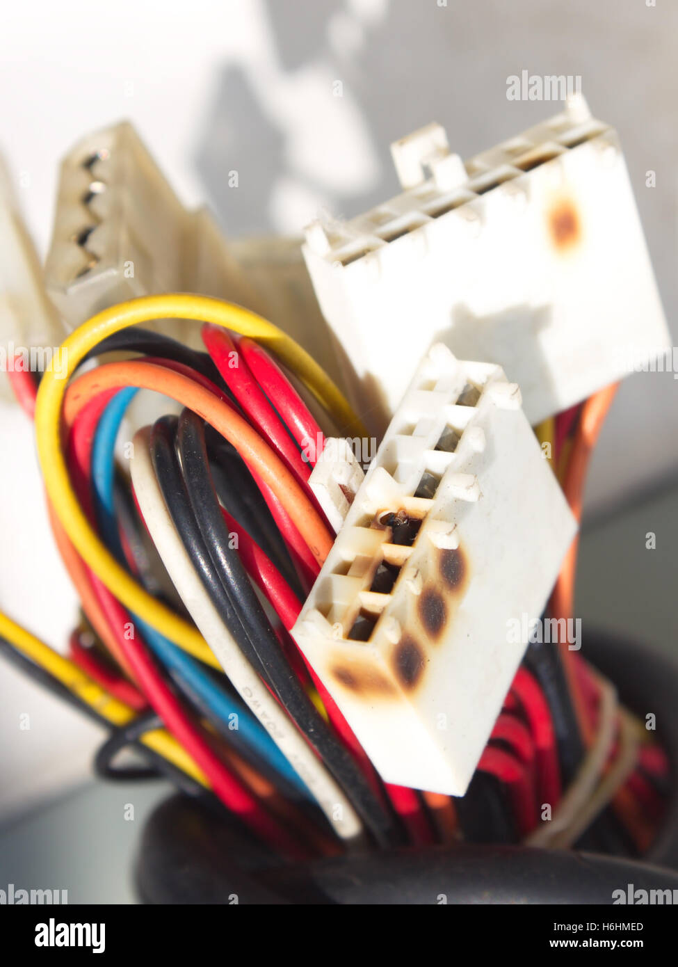 Damage computers power line socket because of shortcircuit Stock Photo