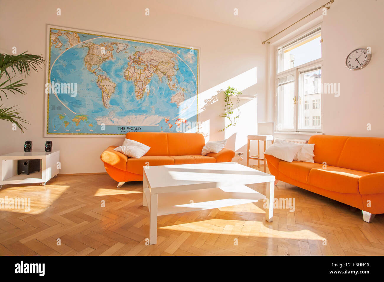 Modern,minimalist living room with resting space, racks and desk corner