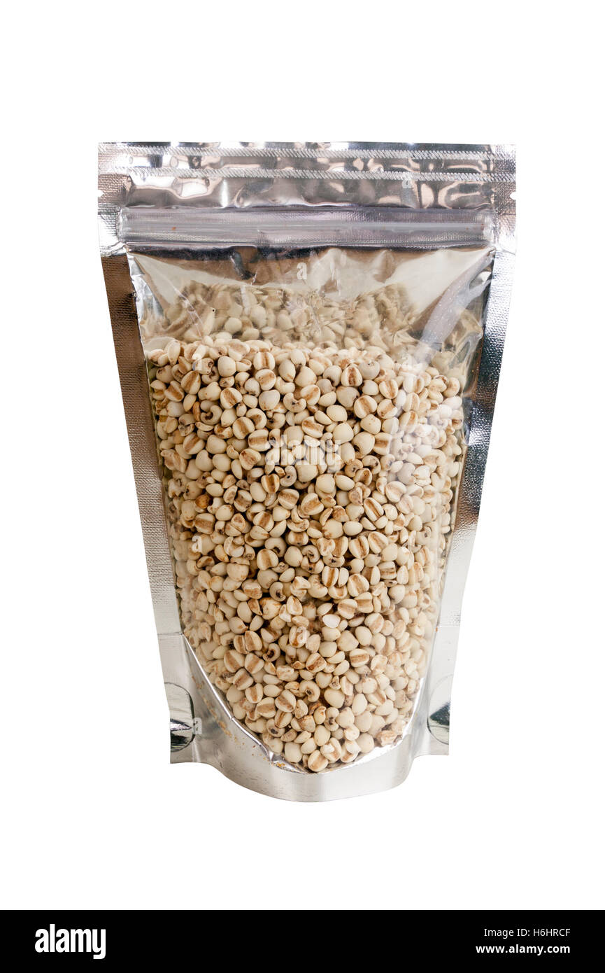cereal Job's tears raw in packaging foil zip lock bag. Isolated on white with clipping paths. A Chinese plant used in traditiona Stock Photo