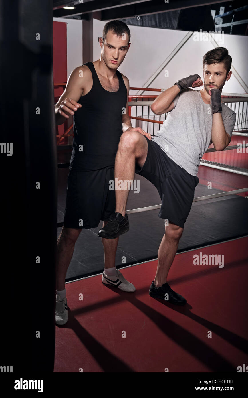 https://c8.alamy.com/comp/H6HTB2/handsome-man-working-on-kick-boxing-hook-H6HTB2.jpg