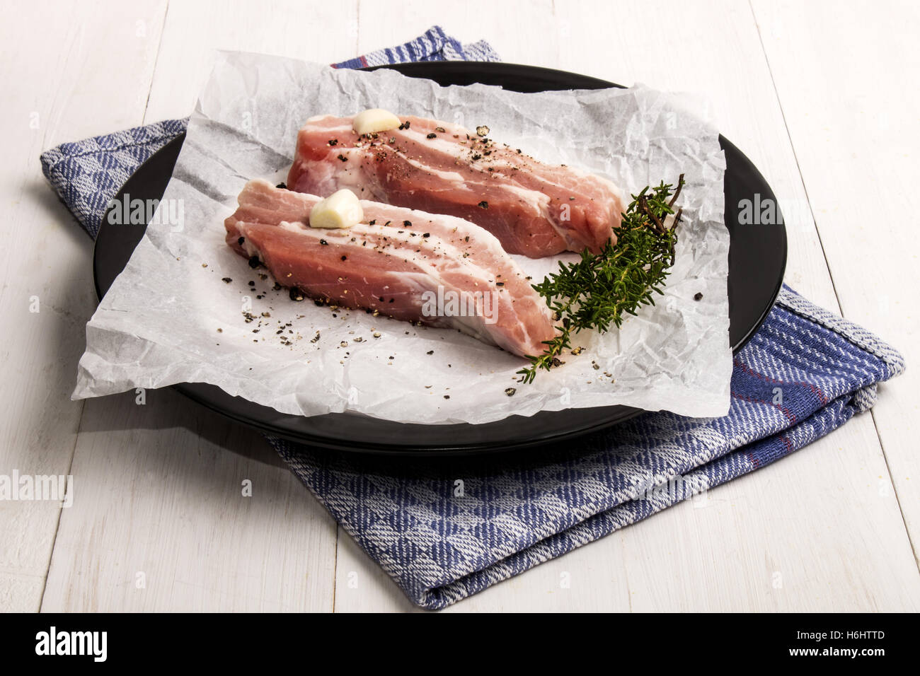 pork belly stripes with crushed peppercorn, thyme and garlic with white