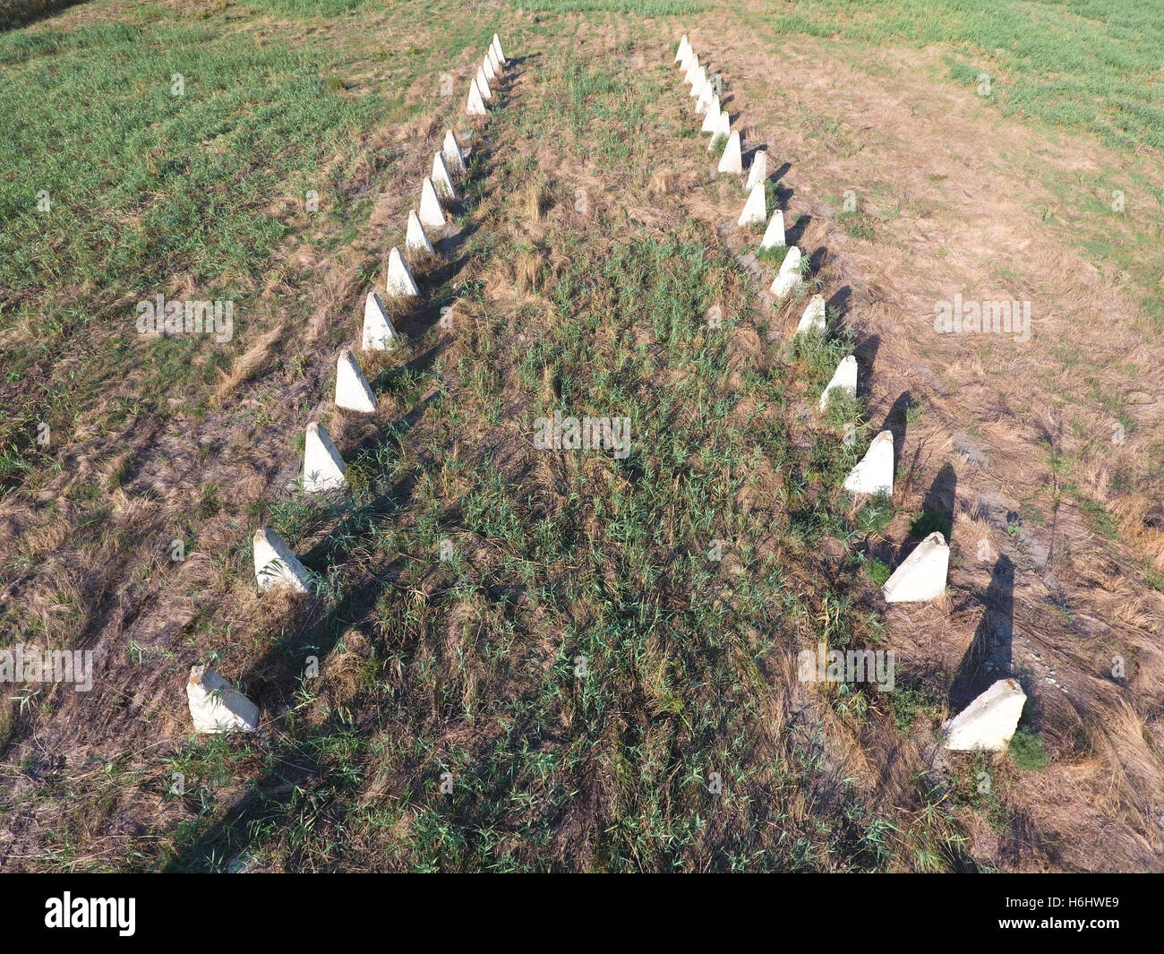 The ruins of the old farm. Cones column base of the wall. Abandoned and ...