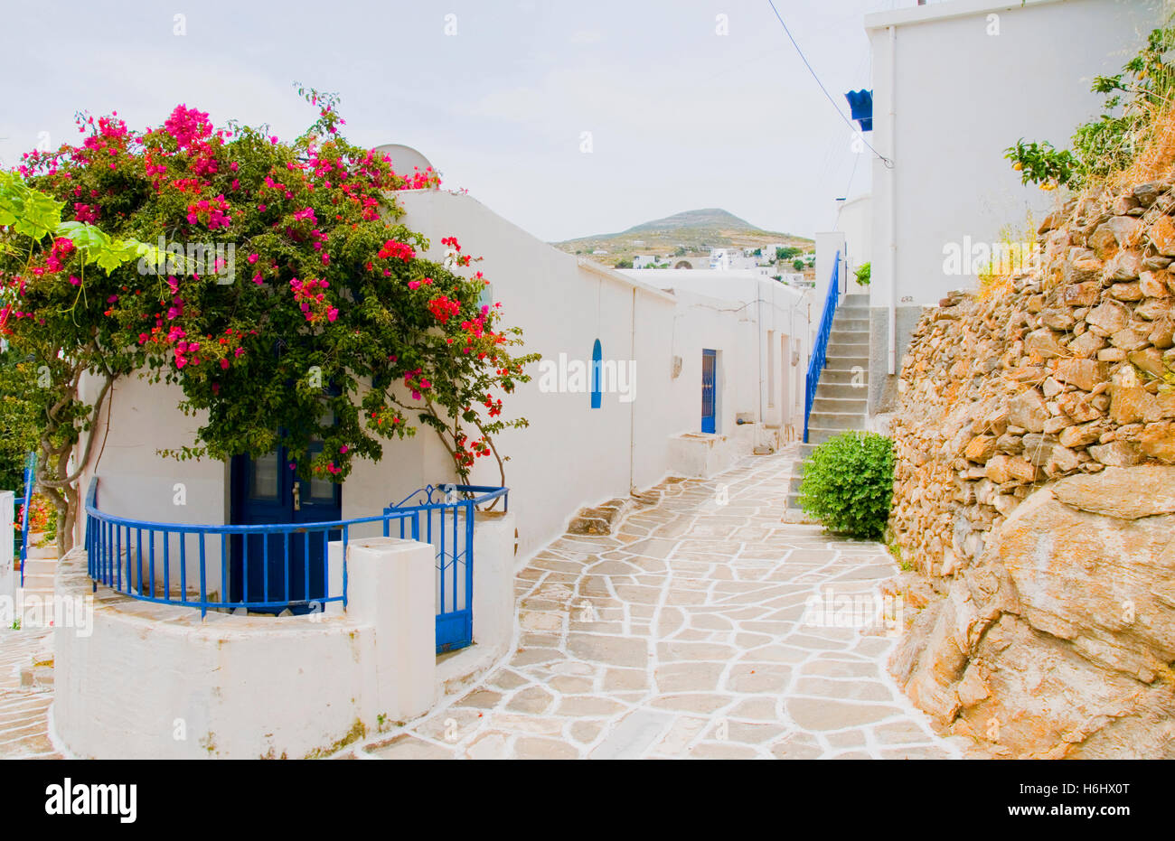 street scene Greek Island Milos white stucco painted houses classic ...