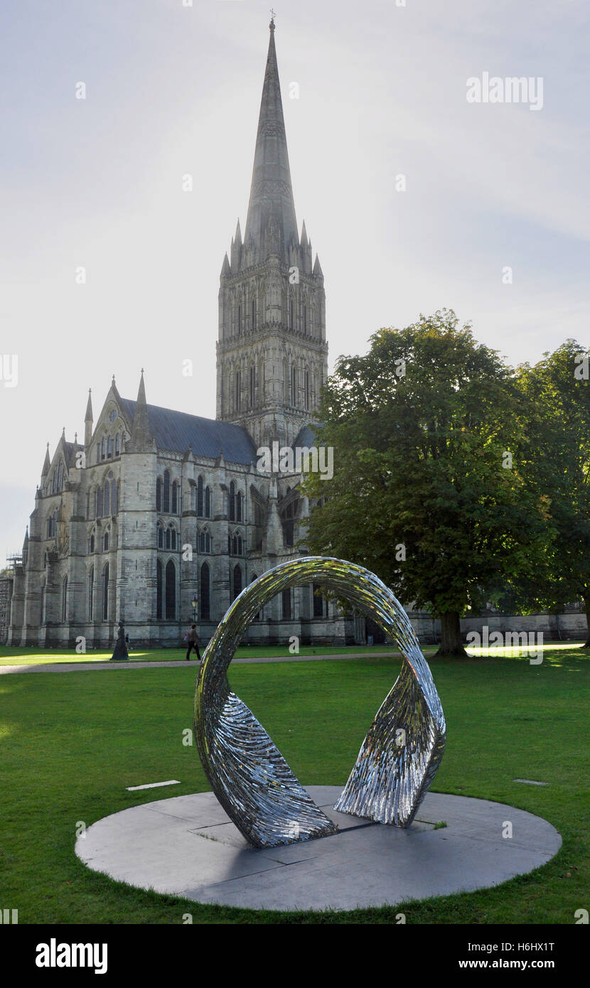 Salisbury Cathedral - view against the light - sculpture in foreground - sunlight and shadows - atmospheric Stock Photo