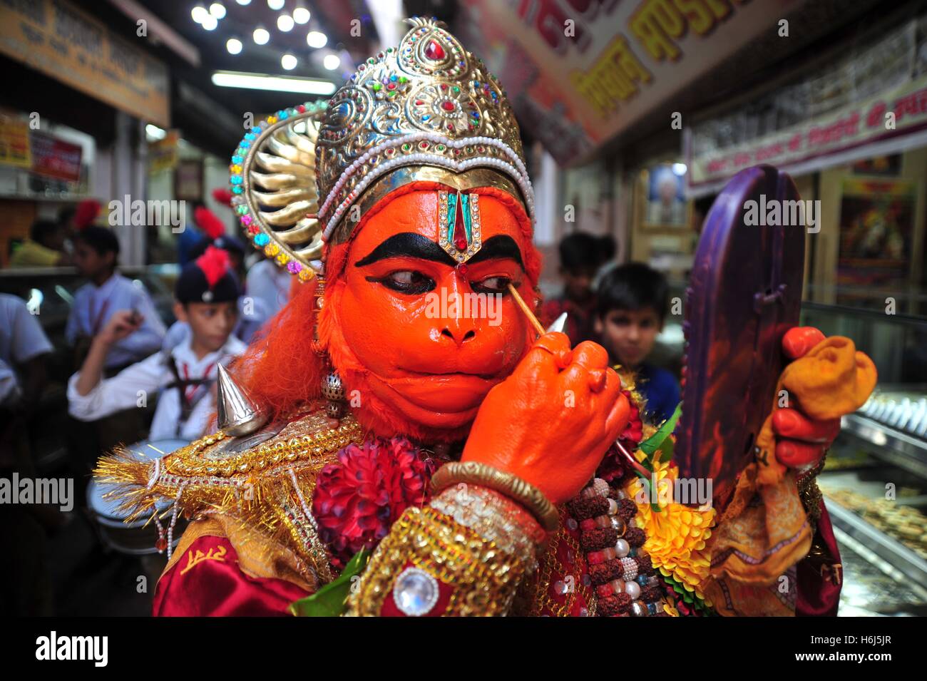Allahabad, Uttar Pradesh, India. 29th Oct, 2016. An Artist getting made up as the monkey god Hanuman to take part in a religious procession on the occasion of Hanuman Jayanti in Allahabad. Hanuman Jayanti commemorates the birth of the Hindu God Haunman. © Prabhat Kumar Verma/ZUMA Wire/Alamy Live News Stock Photo