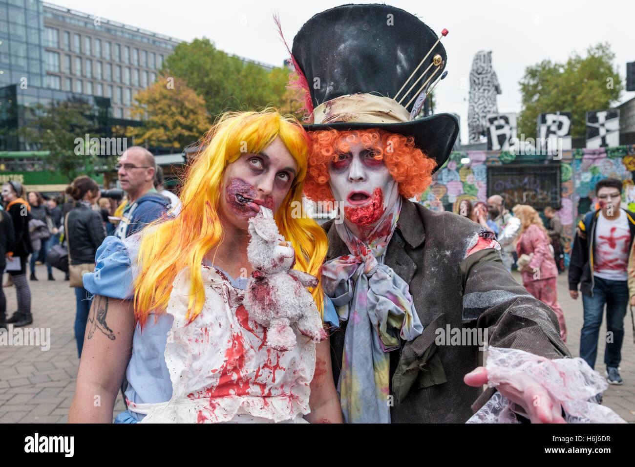 Bristol, UK. 29th Oct, 2016. Two people dressed as zombies with painted faces,make up and dressed as zombies are pictured as they participate in a Zombie Walk In Bristol. Credit:  lynchpics/Alamy Live News Stock Photo