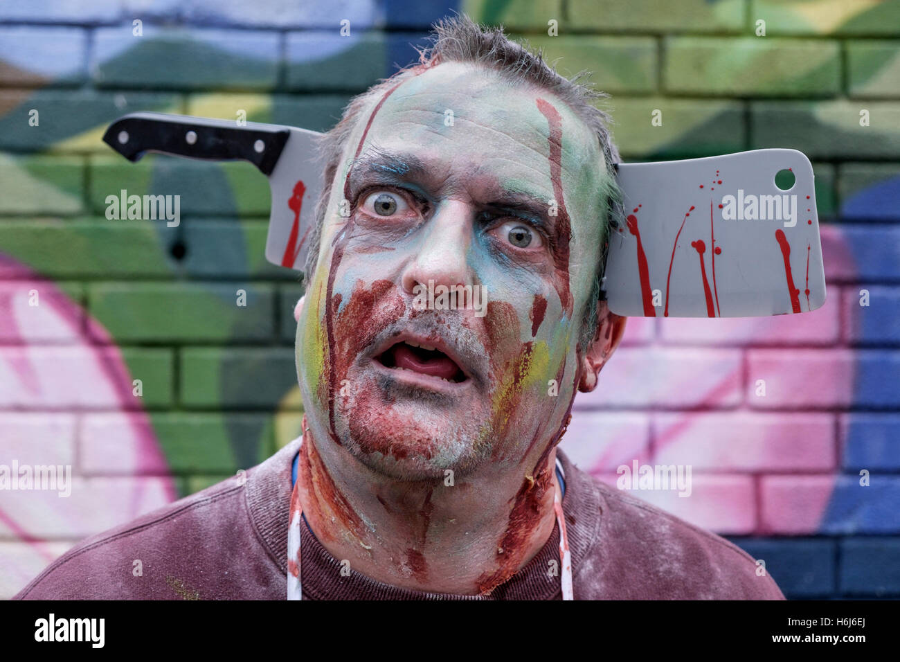 Bristol, UK. 29th Oct, 2016. A man dressed as a zombie poses for a photograph as he participates in a Zombie Walk In Bristol. Credit:  lynchpics/Alamy Live News Stock Photo