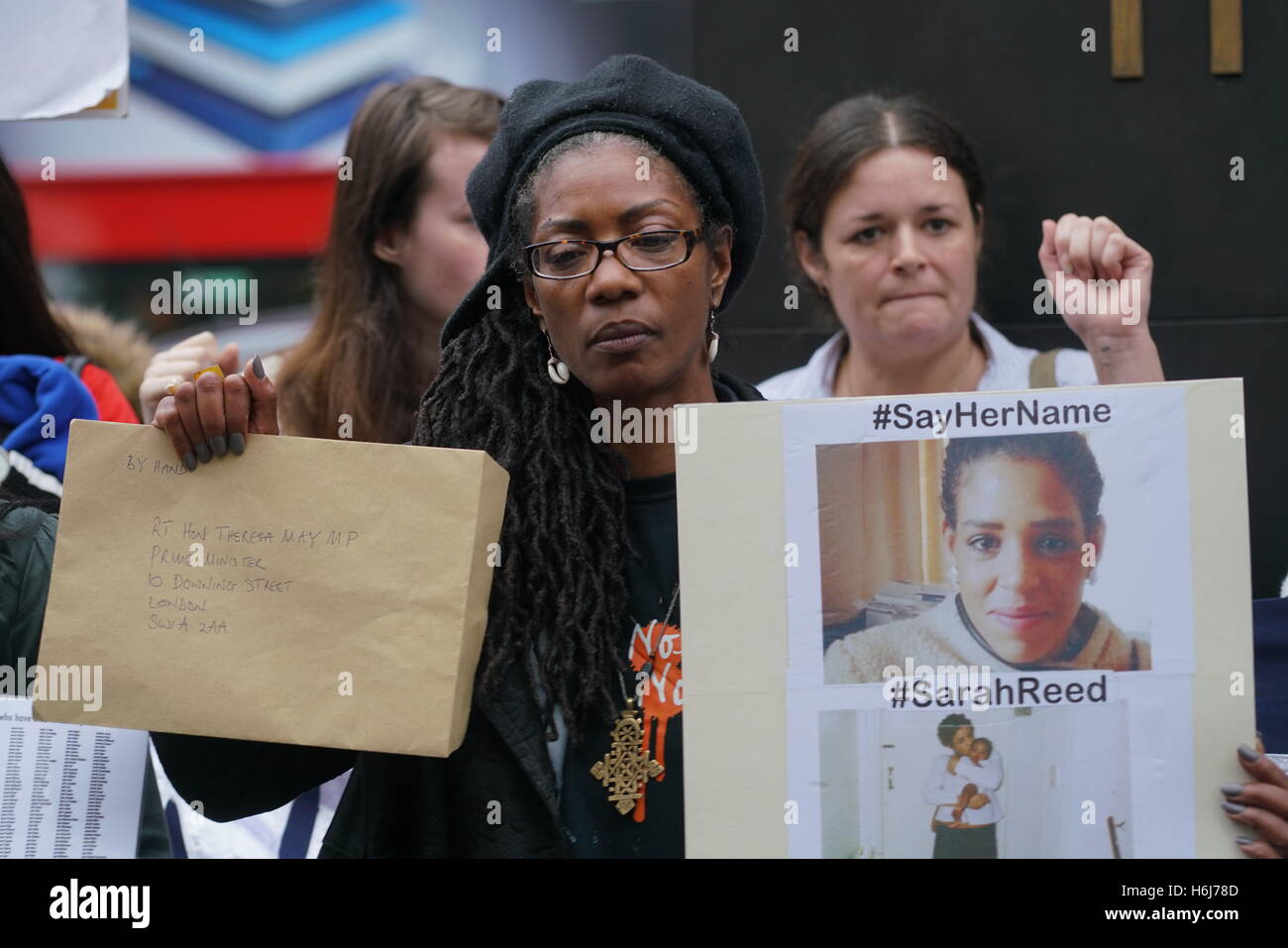 London, UK. 29th October, 2016. Marcia Rigg, one of the sisters of Sean Rigg, killed by police in Brixton in 2008 addresses the crowds through a loudhailer outside Downing Street. Credit:  See Li/Alamy Live News Stock Photo
